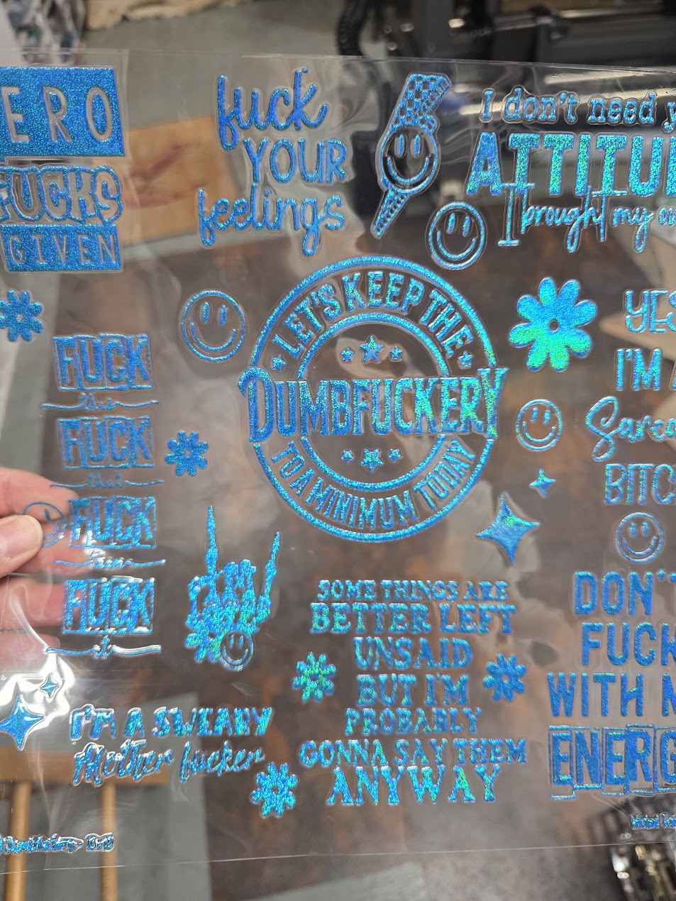 UVDTF Prism Blue Holographic Dumbf*ckery 11"x11"
