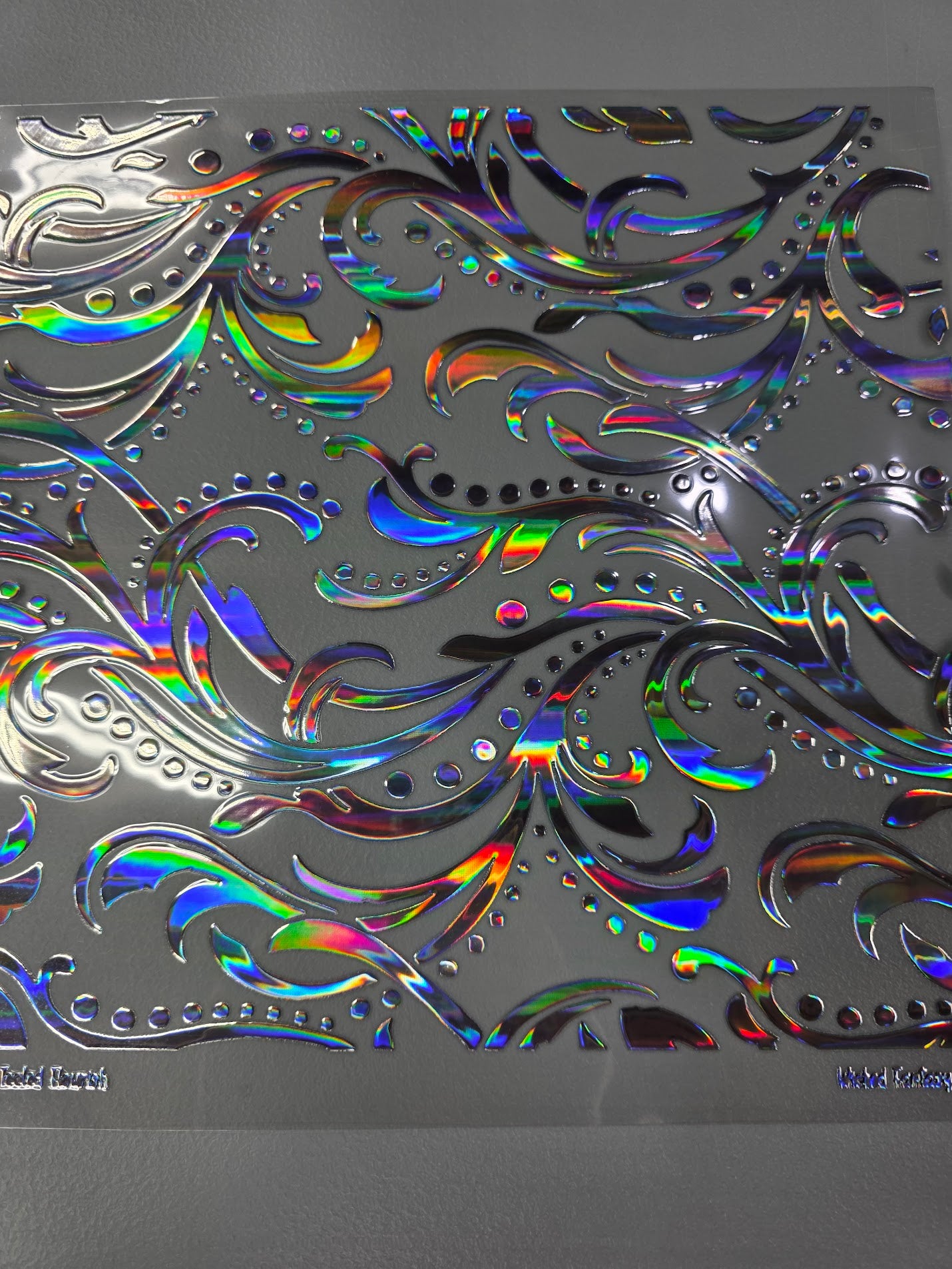 UVDTF Laser Silver Holographic Large Tooled Flourish 11x11"