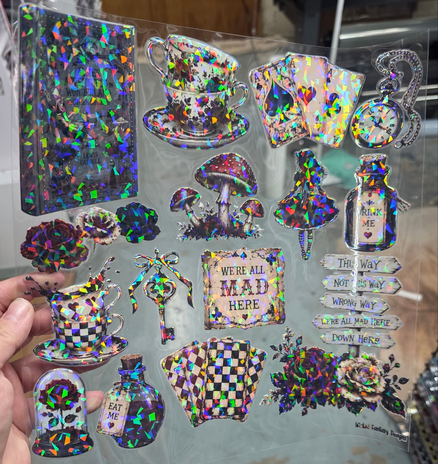 UVDTF Shattered Holographic We're All Mad Here 11"x11"