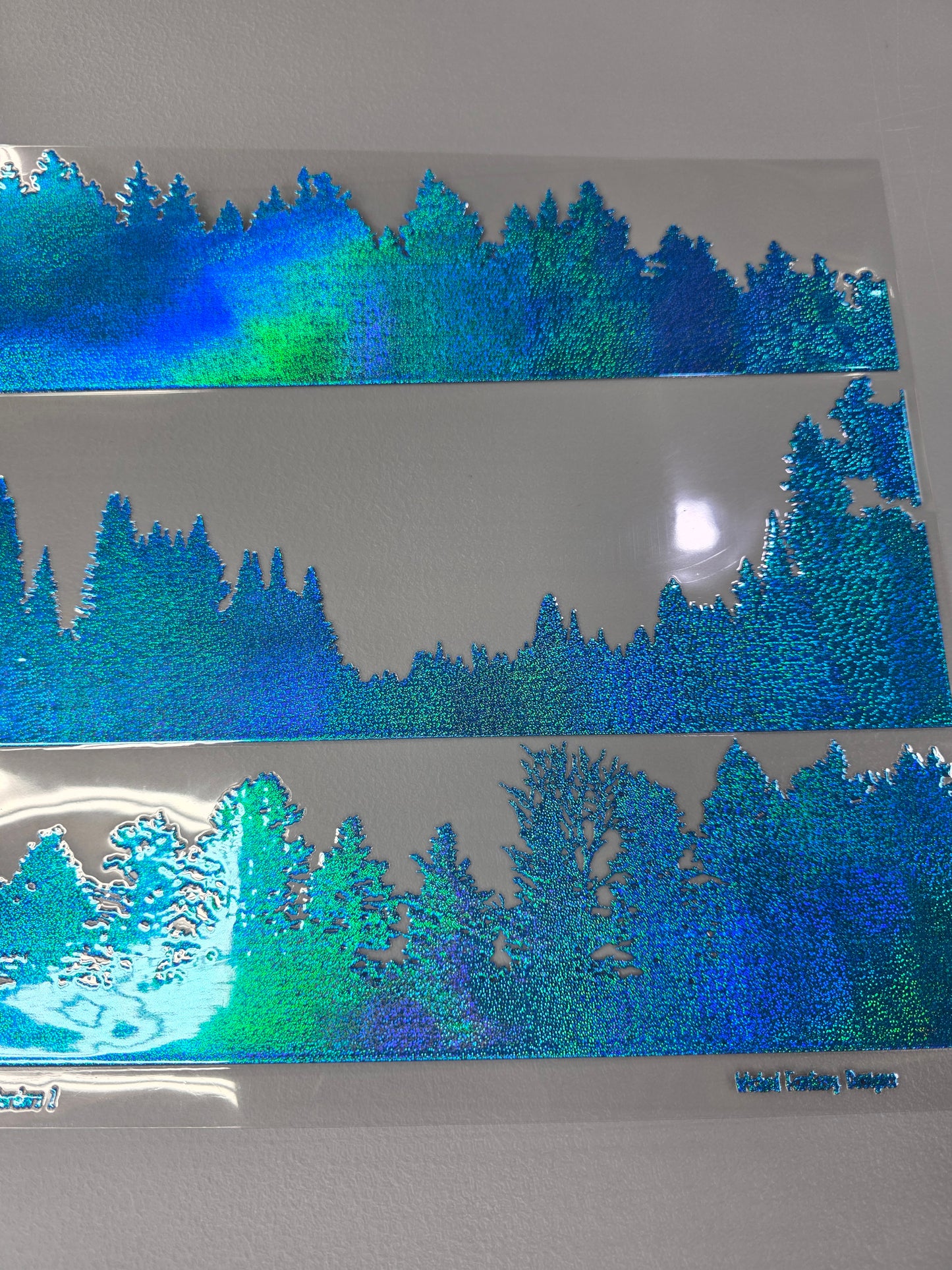 UVDTF Prism Blue Holographic Tree Line View 11"x11"