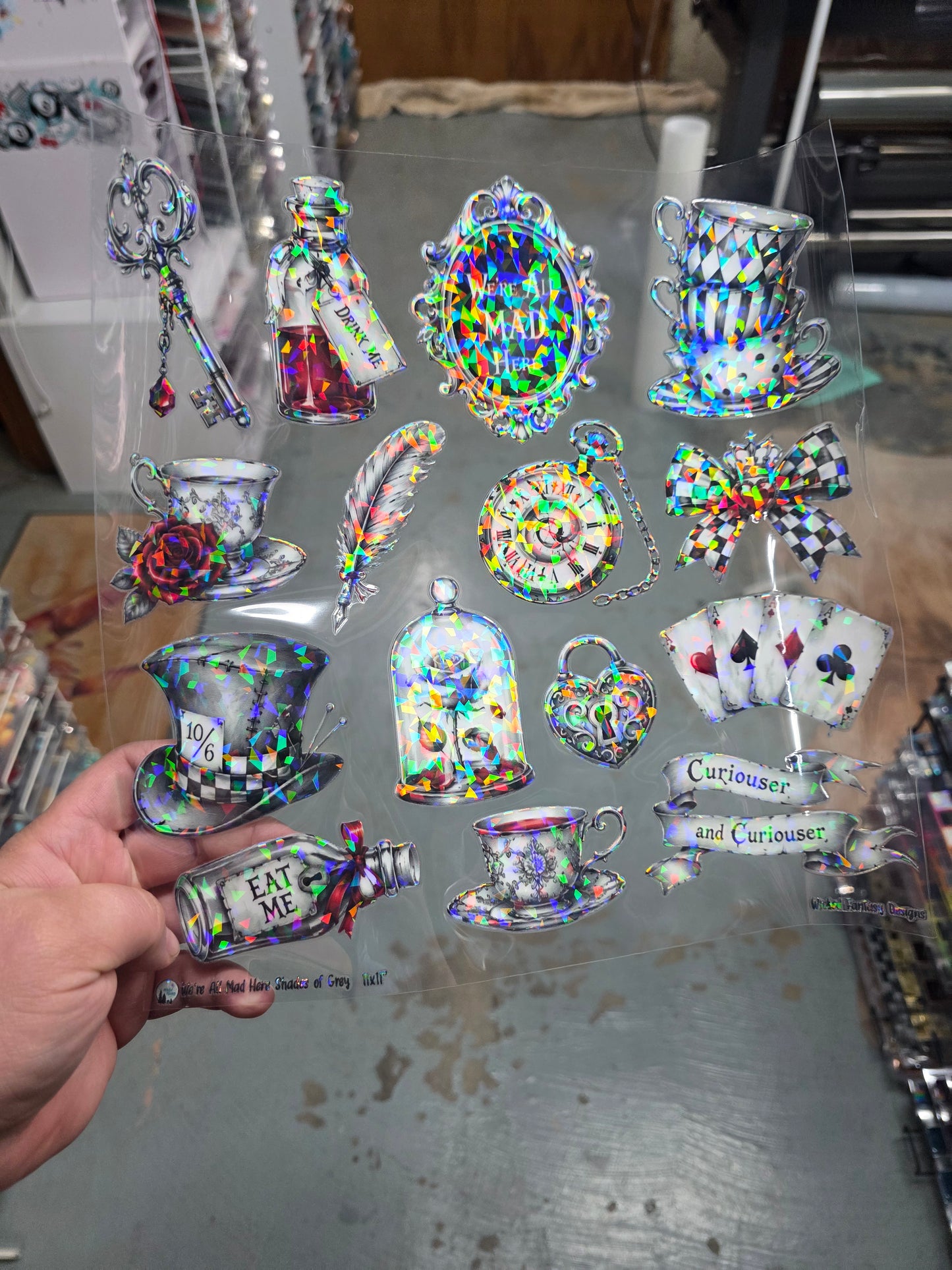 UVDTF Shattered Holographic We're All Mad Here Shades of Grey 11"x11"