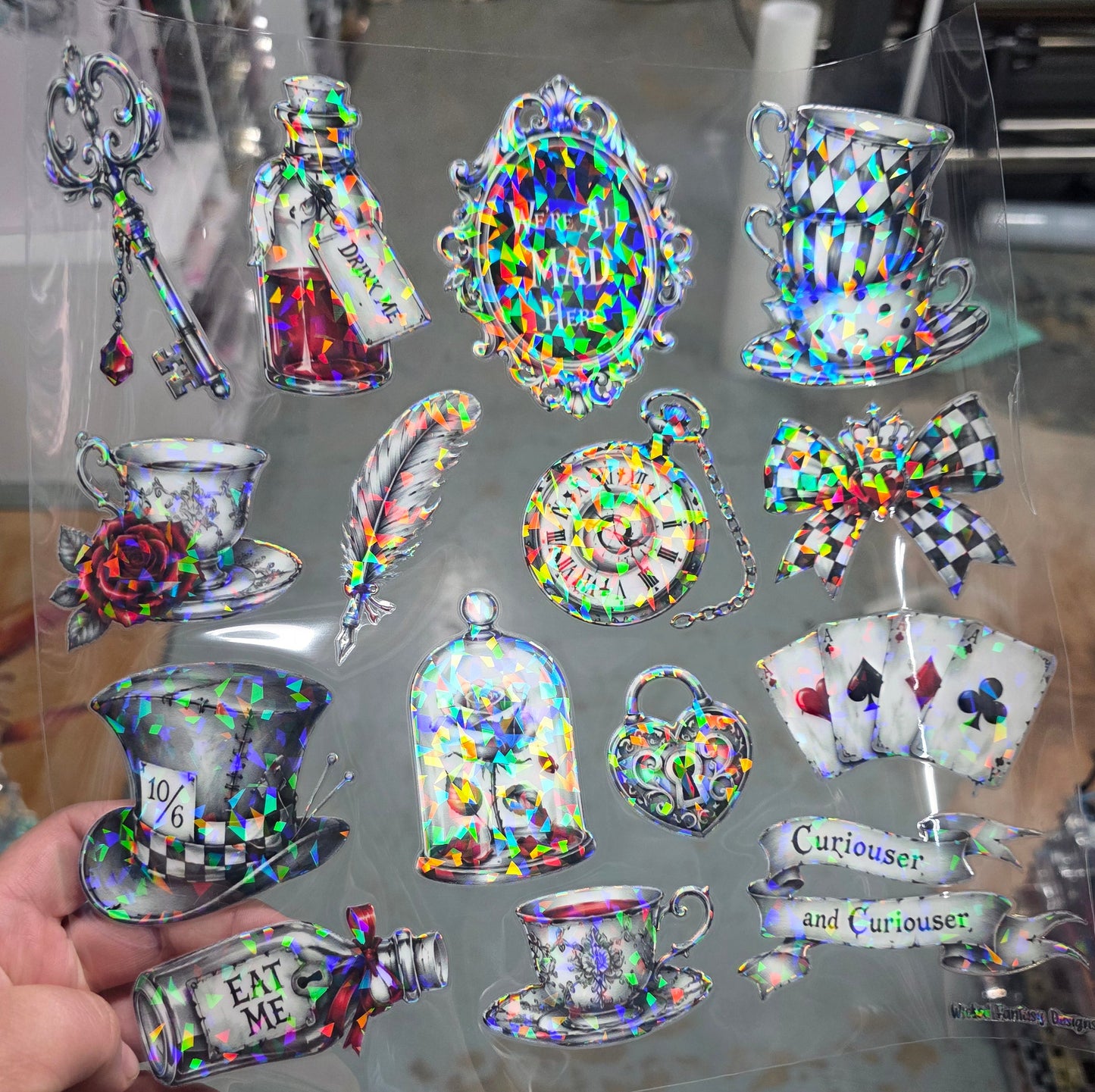 UVDTF Shattered Holographic We're All Mad Here Shades of Grey 11"x11"
