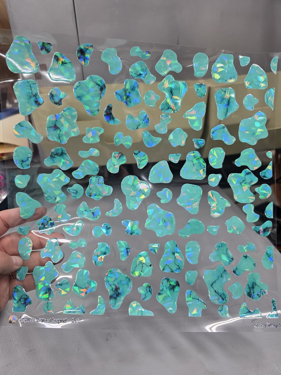 UVDTF Shattered Holographic Turquoise Rounded Cow Print 11"x11"