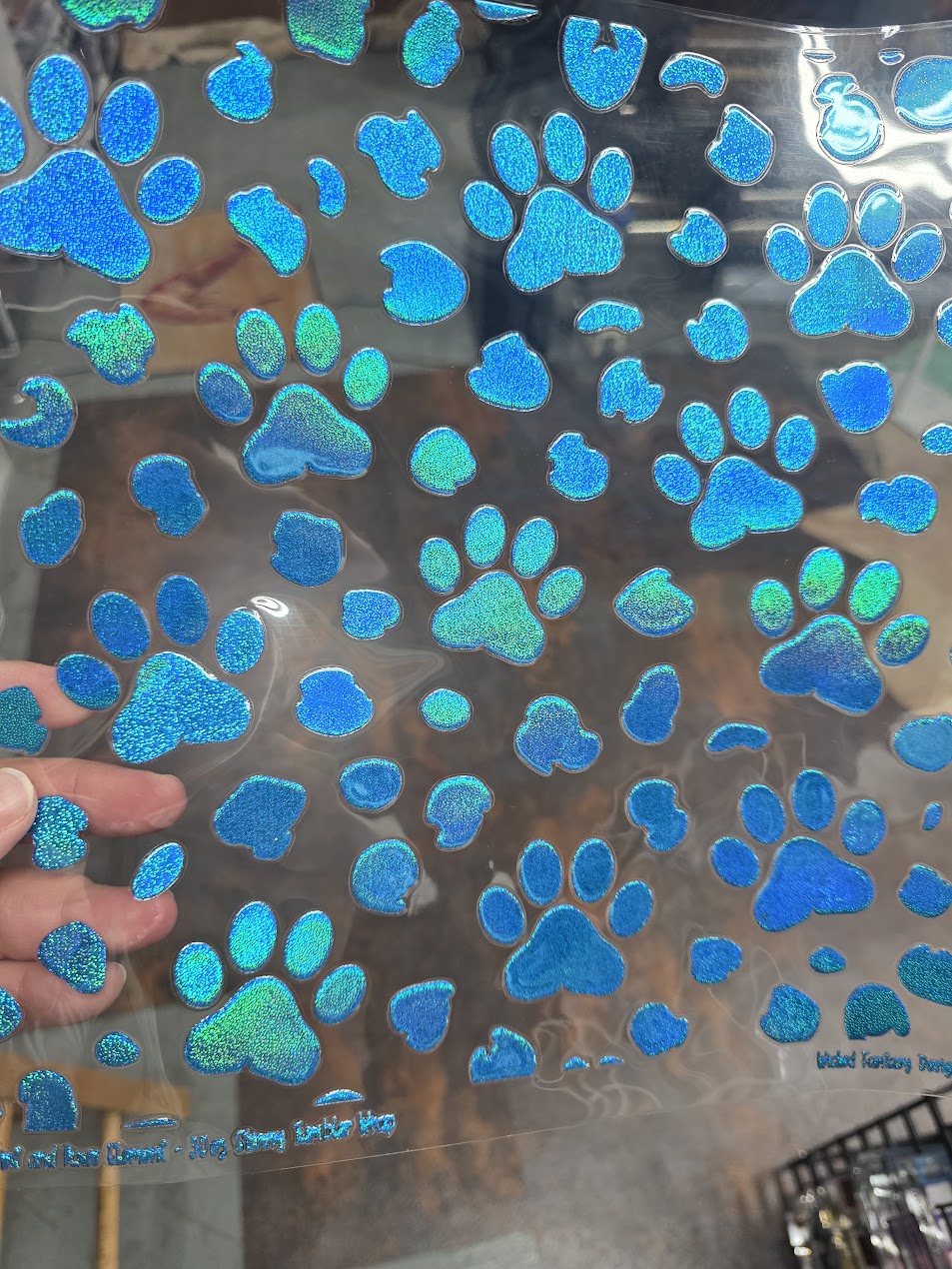 UVDTF Prism Blue Holographic Paw Prints 11"x11"