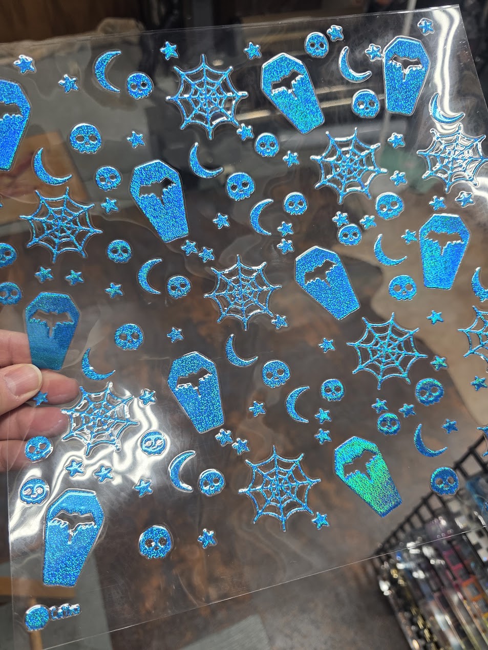 UVDTF Prism Blue Holographic Coffins and Skulls 11"x11