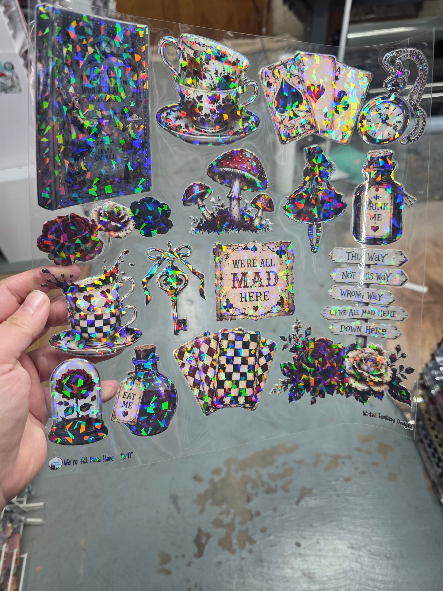 UVDTF Shattered Holographic We're All Mad Here 11"x11"